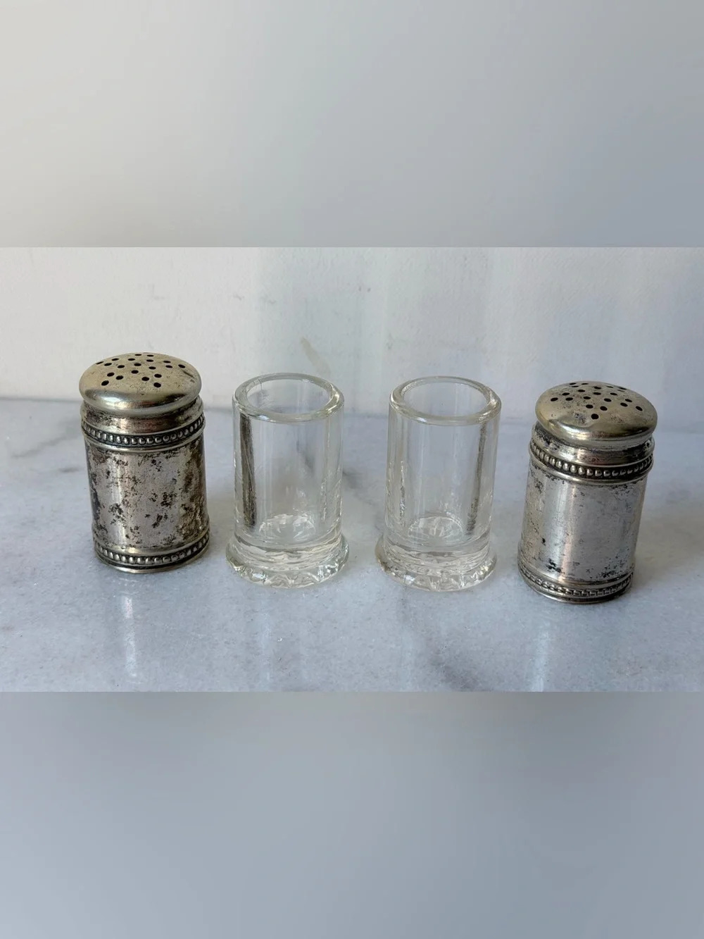 pair of antique EPNS silver salt and pepper shakers